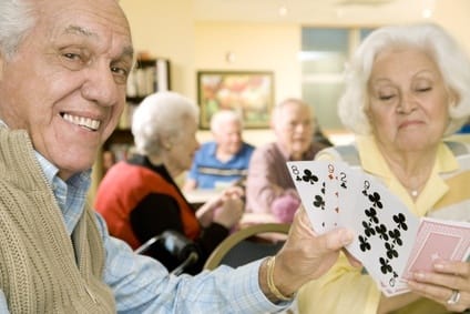 Elderly playing cards