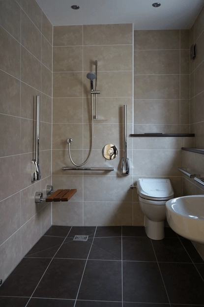 Wet room with stone flooring