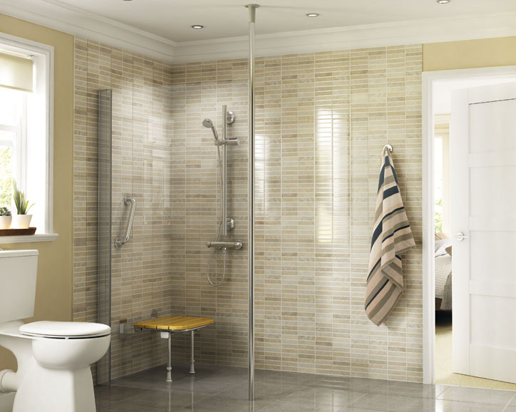Modern accessible bathroom with a walk-in shower, safety grab bars, a wall-mounted showerhead, and a foldable shower seat.