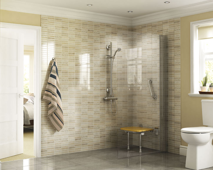 Modern accessible bathroom with a walk-in shower, safety grab bars, a wall-mounted showerhead, and a foldable yellow shower seat. A striped towel hangs on the wall, and a toilet is visible in the foreground.
