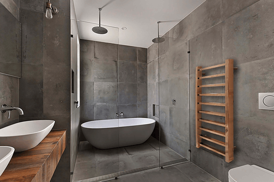 Modern bathroom with freestanding white bathtub, dual overhead rain showers, and wall-mounted wooden towel warmer.