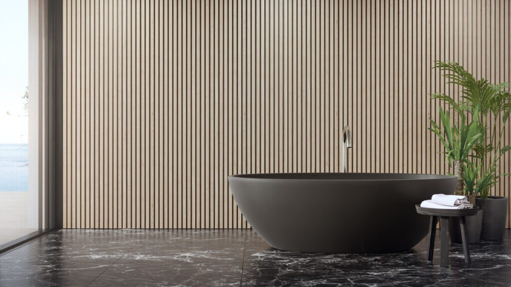 bathtub on black marble floor of large bathroom in modern house or luxury pool villa