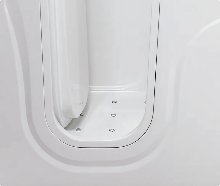 Close-up view of the side-opening door on the Derwent walk-in bath, showing the white frame and the internal floor with built-in jets, designed for accessibility and comfort.