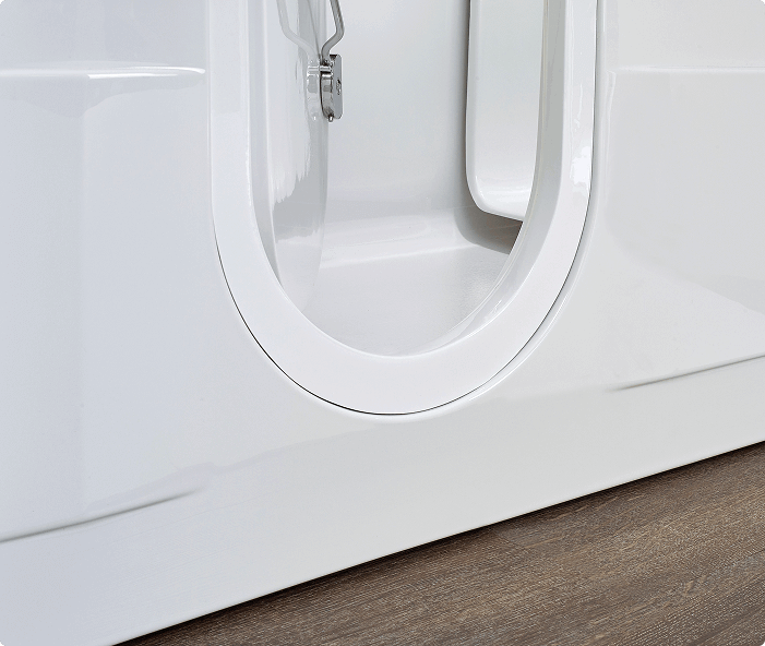 This is the base of the Leyburn walk-in bath, showcasing its durable, smooth white finish and the sealed, curved door design. The base is constructed for stability and easy cleaning, contributing to the overall safety and accessibility of the bath. The seamless integration of the door with the bath frame ensures a watertight seal, preventing leaks and maintaining a clean bathroom environment.