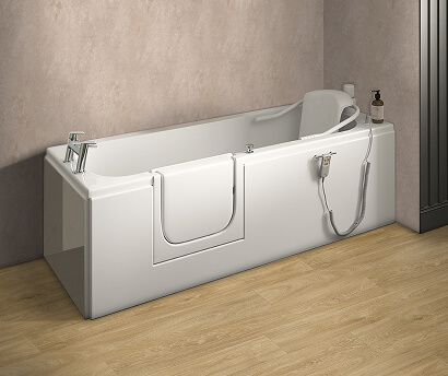 The Windermere walk-in bath with integrated seat and side entry door, shown in a modern bathroom with light wood flooring and soft neutral walls.