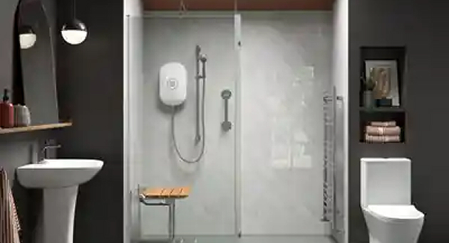 Modern mobility wet room with a Richmond sliding glass enclosure, electric shower unit, fold-down seat and dark contrast walls with open shelving.