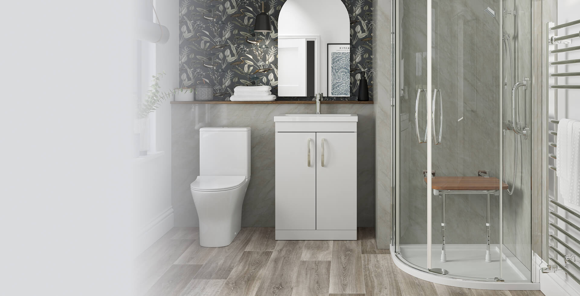 Modern bathroom with a quadrant-shaped glass shower enclosure featuring twin chrome handles and a wooden folding seat, next to a vanity unit, toilet, and patterned wallpaper accent.
