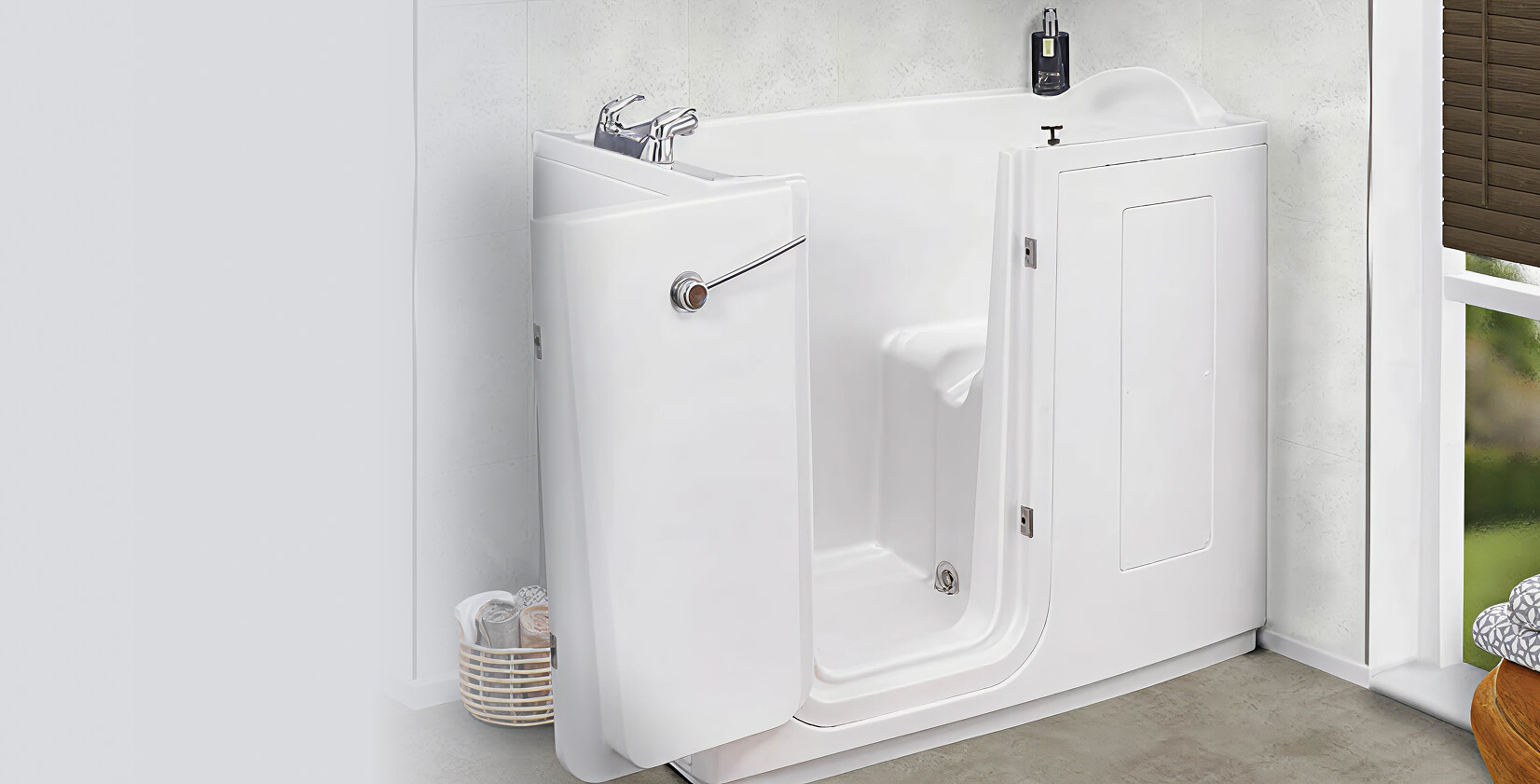 Walk-in bath with open side door, white finish, built-in seat, and chrome taps, set in a light bathroom space with a window and a wicker basket holding towels nearby.