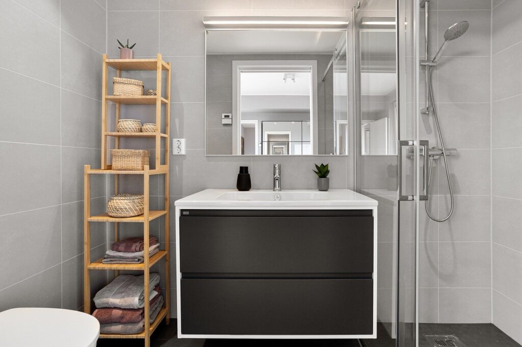 An image of bathroom storage solutions including shelving and a vanity